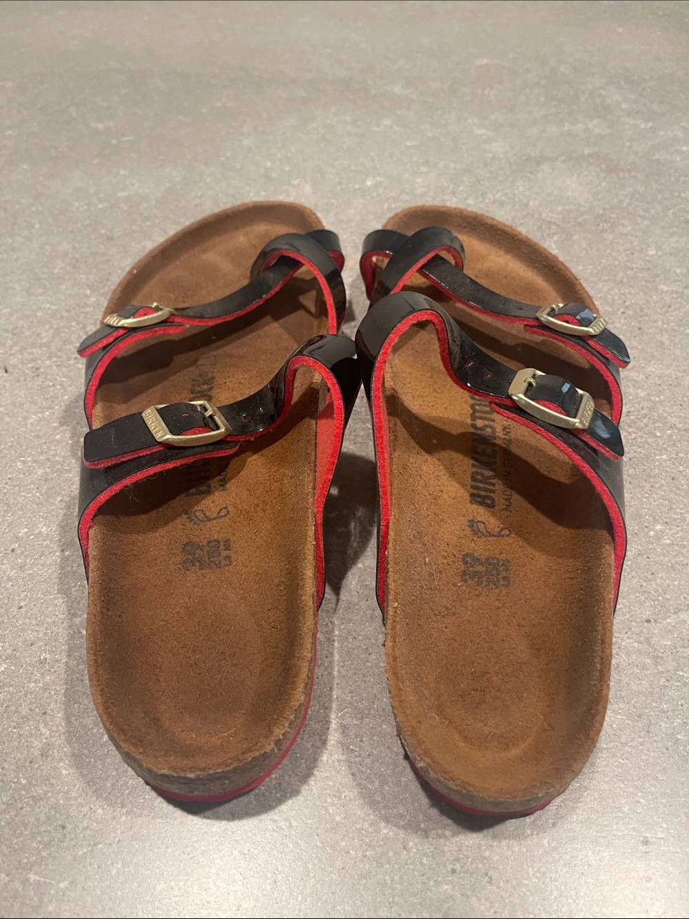 Birkenstock Black Sandals with Red Trim and Gold Buckles